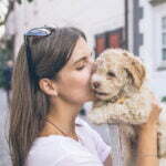 woman with dog in profile testimonial eg